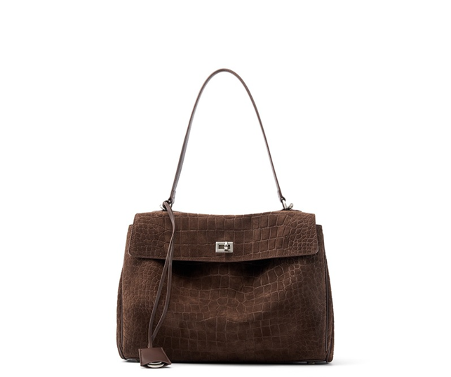 "Luxurious brown suede leather tote bag with crocodile-embossed texture and minimalist silver hardware, shown from the front."