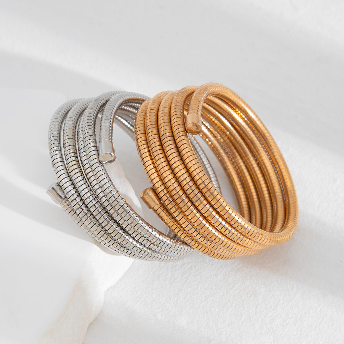 Elegant Gold and Silver Coil Wrap Bracelet – Bold Multi-Layered Statement Bangle